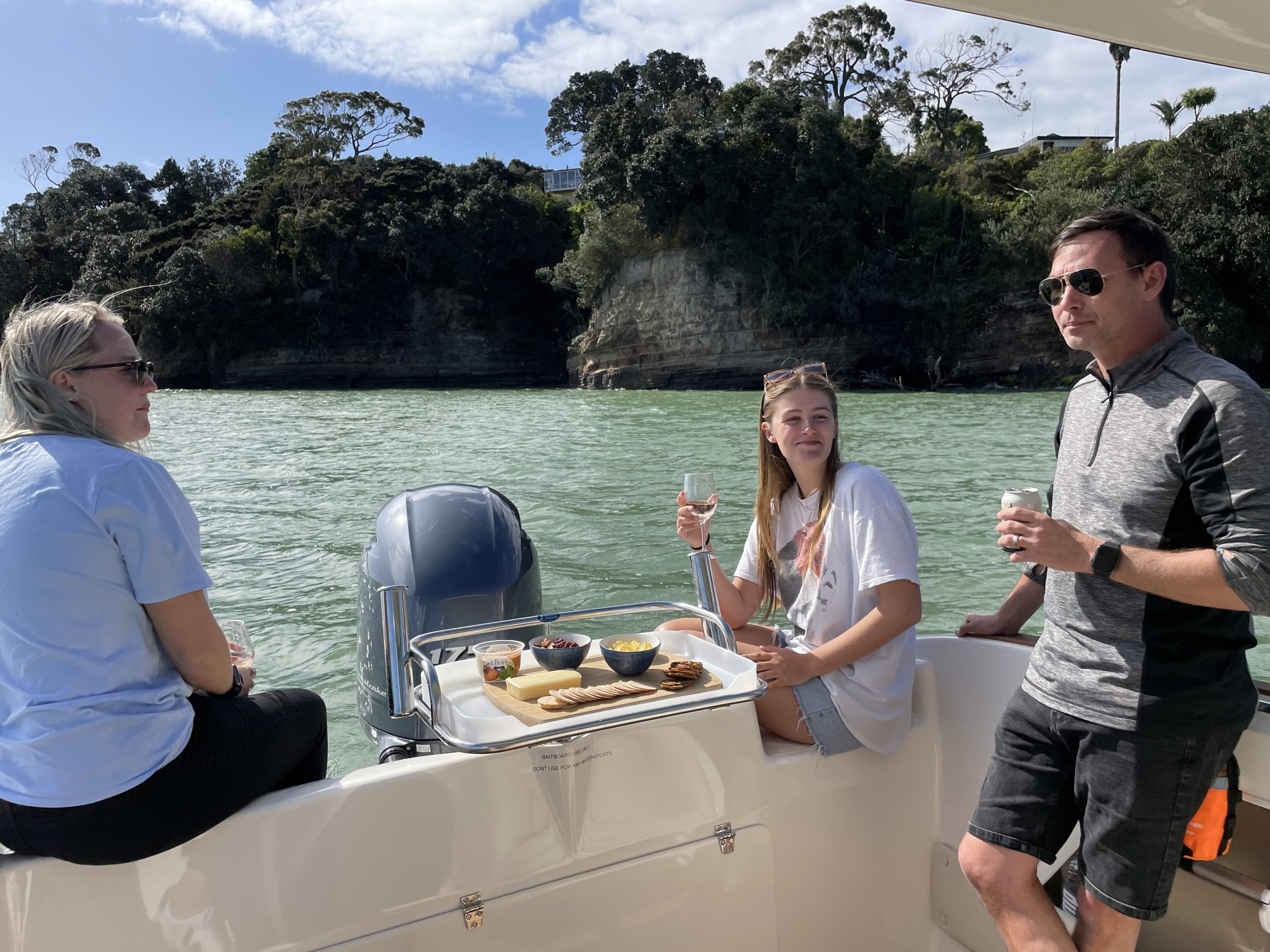 Members enjoying a platter on board a Daily boat
